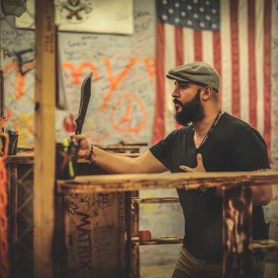 a man standing in front of a laptop