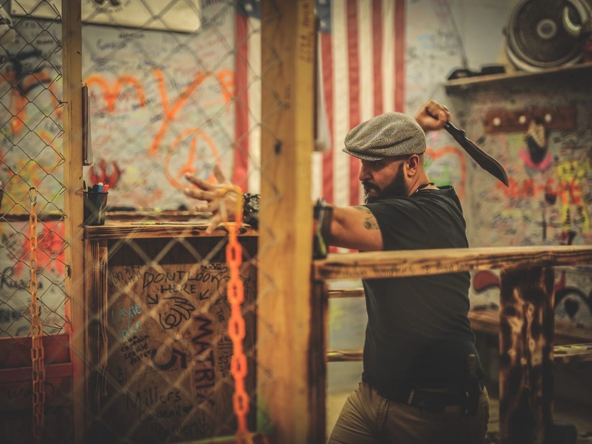 a person standing in front of a mirror posing for the camera